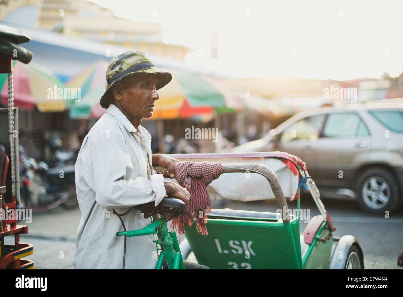 A cyclo driver waiting for customers, transportation in Cambodia Stock Photo