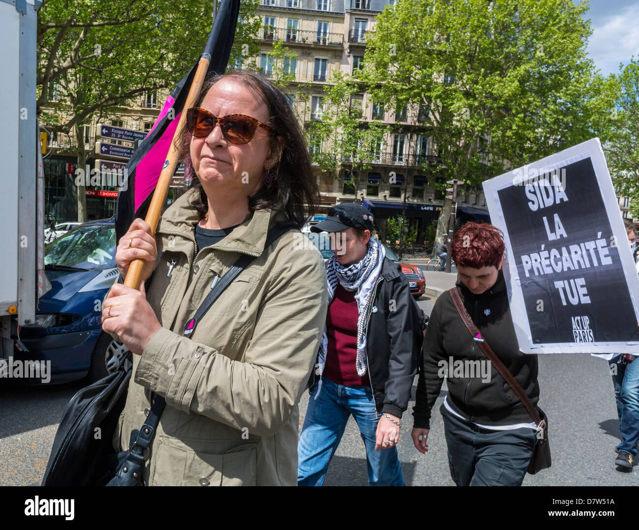Paris, France, Act Up Militants, Nurses Demonstration, Collective For Support of Government Funding for Public Health Care, Transgender WOman, Carole, Carrying Flag on Street in March, women marching LGBTQ protester Stock Photo