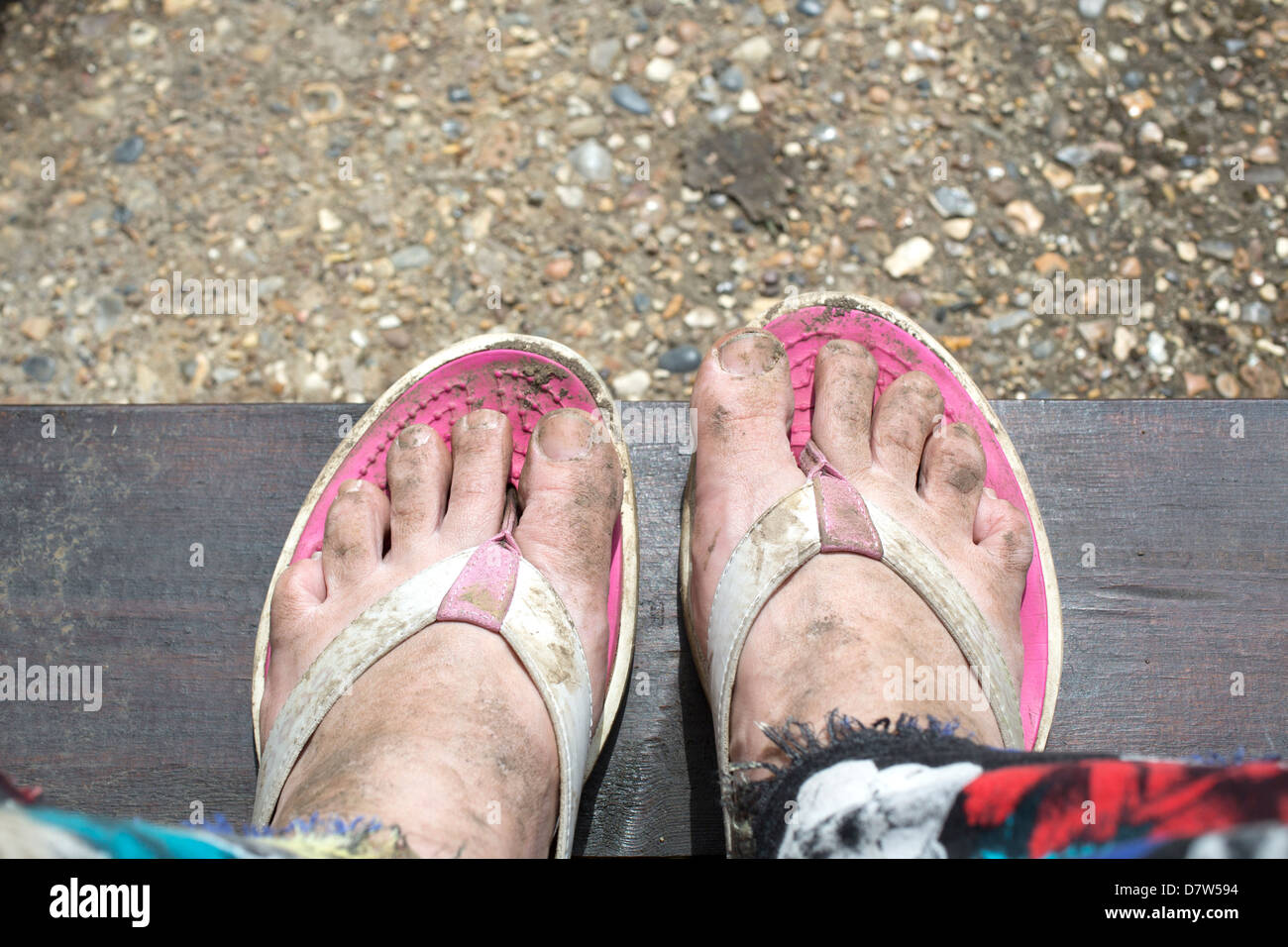 Muddy feet in flip flops hi-res stock photography and images - Alamy