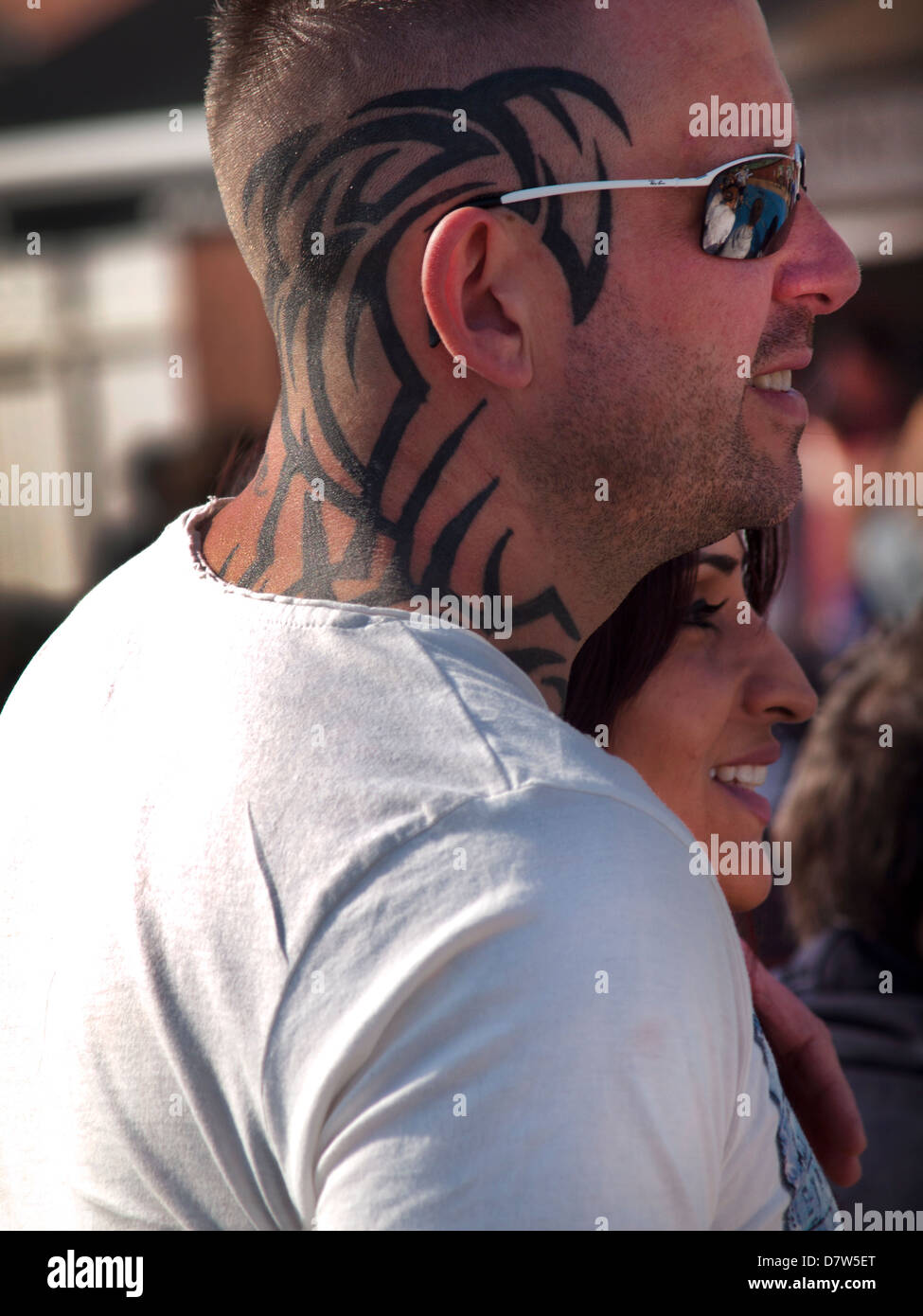 Tribal pattern tattoos on the back of a man's head Stock Photo