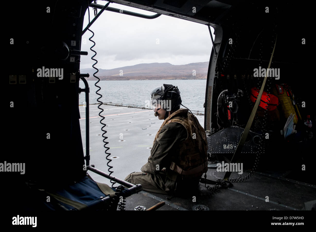 Landing Onto The Flight Deck Of HMS Bulwark In A Royal Navy Sea King Mk 4 Helicopter With The