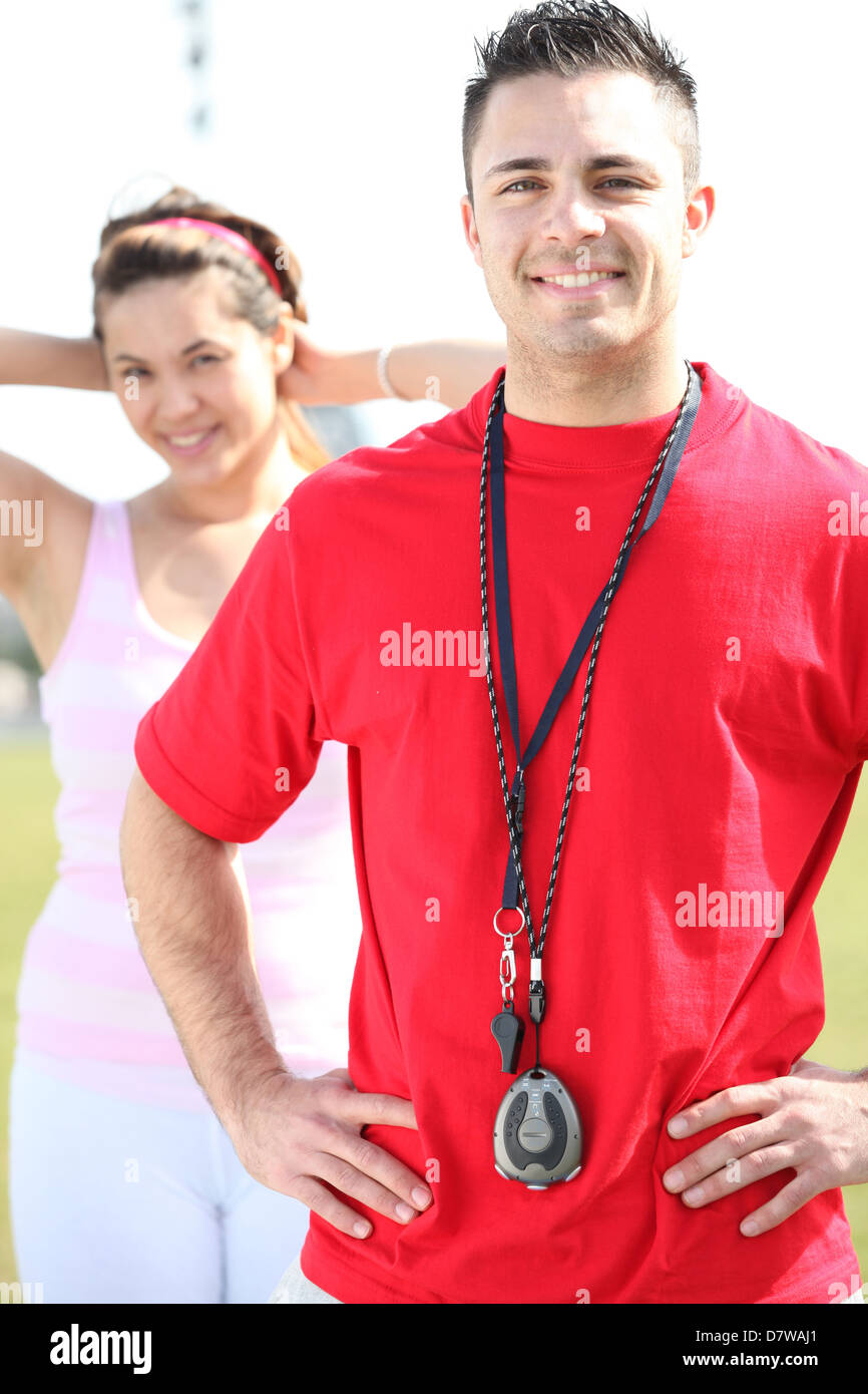 Coach with stopwatch and whistle Stock Photo Alamy