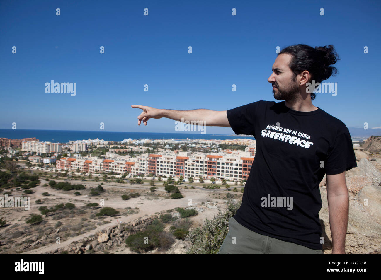 Abandoned construction sites on Spain's coast. A member of Greenpeace shows  Almeriamar, Almeria, Andalucia, Spain, Europe, EU Stock Photo
