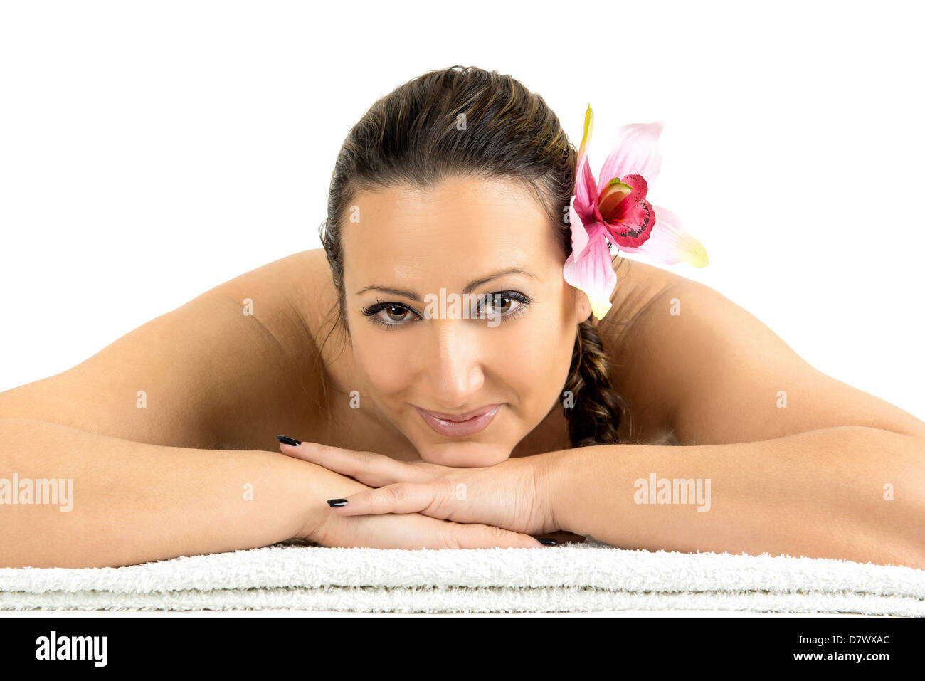Beautiful woman in a stone massage at beauty spa salon. Recreation therapy. Stock Photo