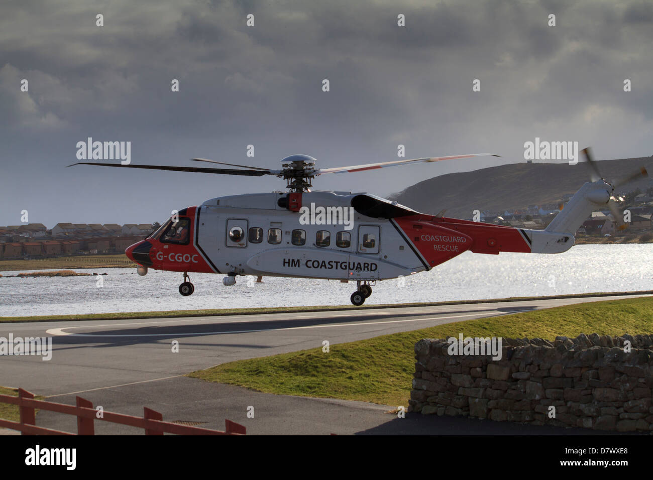 A coastguard helicopter coming in to land at Clickimin Leisure Centre, Lerwick, Shetland Islands Stock Photo