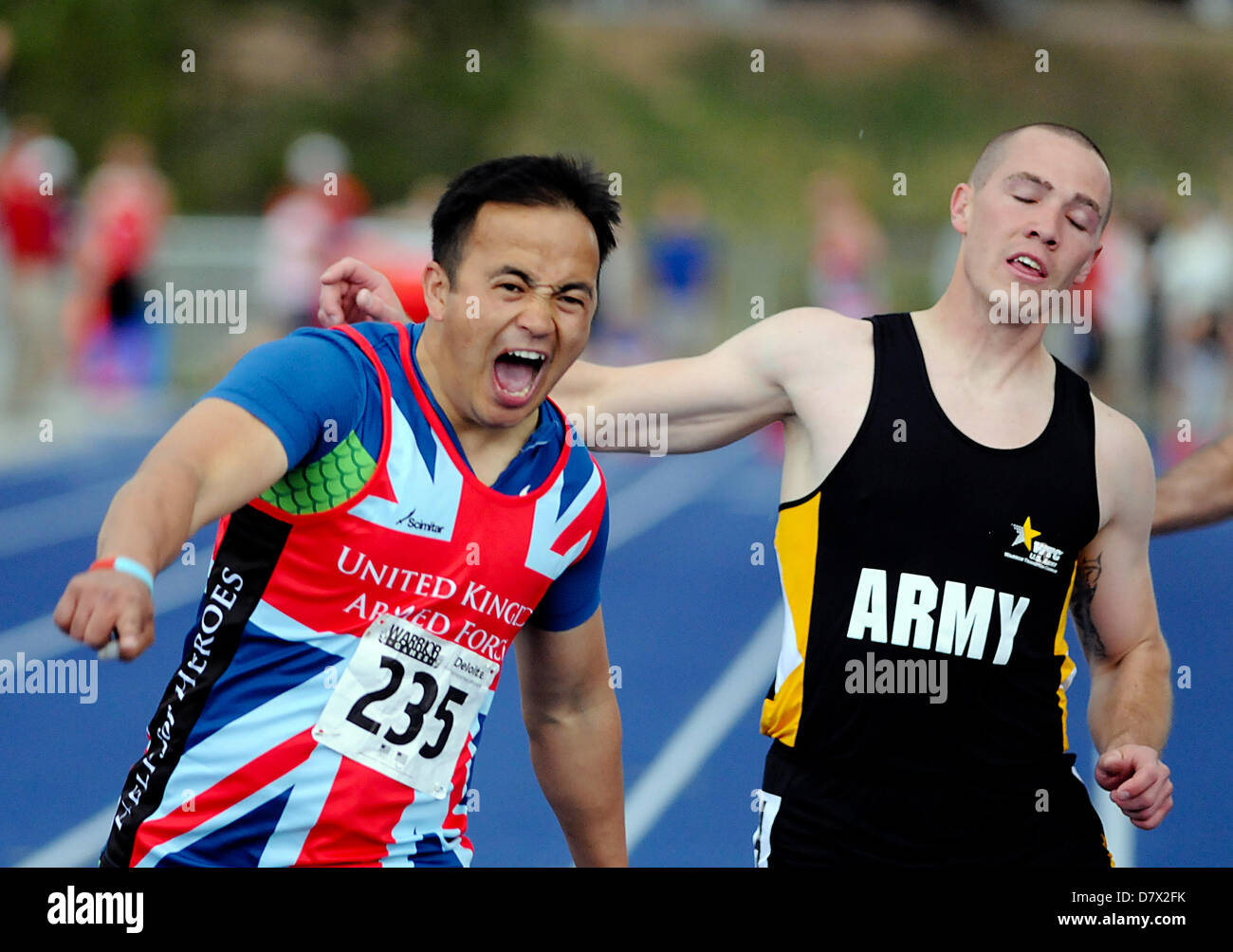 Colorado Springs, USA. 14th May 2013. British Armed Forces wounded warrior, Kushal Limbu, celebrates his victory in the men's 100 meters during Warrior Games track & field events at the United States Air Force Academy, Colorado Springs, Colorado. Over 260 injured and disabled service men and women have gathered in Colorado Springs to compete in seven sports, May 11-16. All branches of the military are represented, including Special Operations and members of the British Armed Forces. Credit:  Cal Sport Media / Alamy Live News Stock Photo