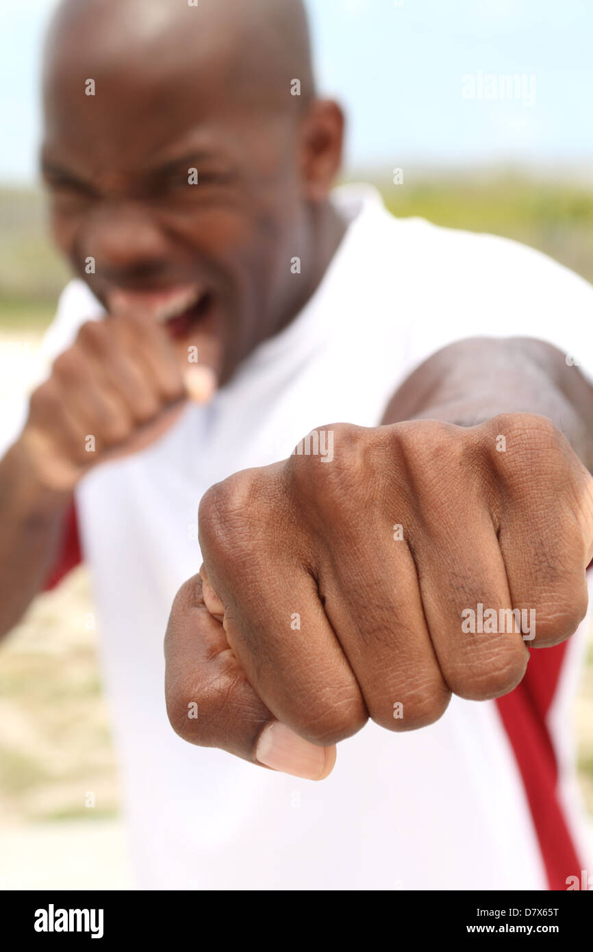 Punch towards camera by black boxer outdoors Stock Photo Alamy