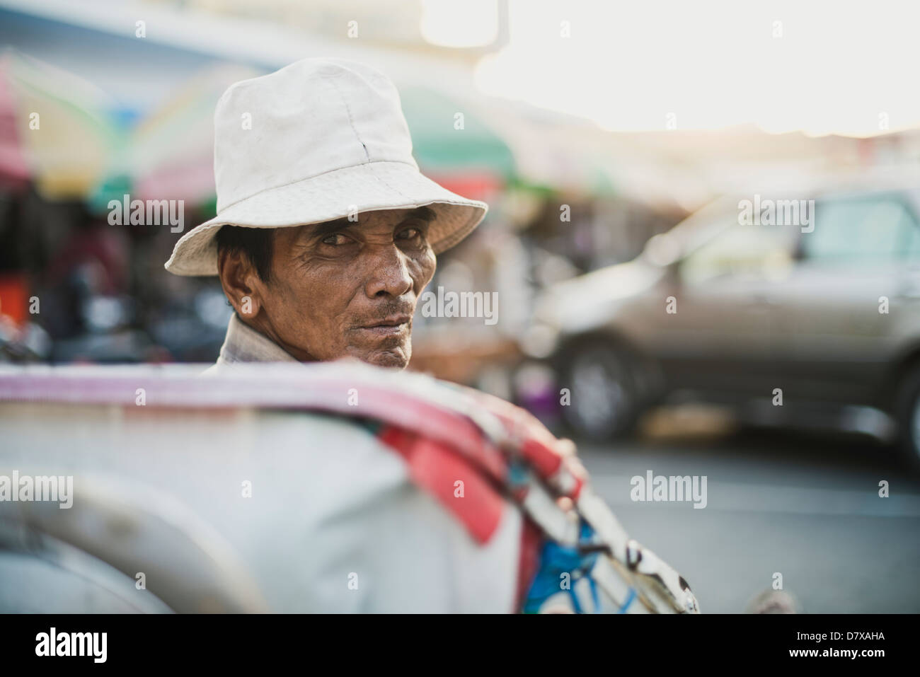 A cyclo driver waiting for customers, Cambodia Stock Photo