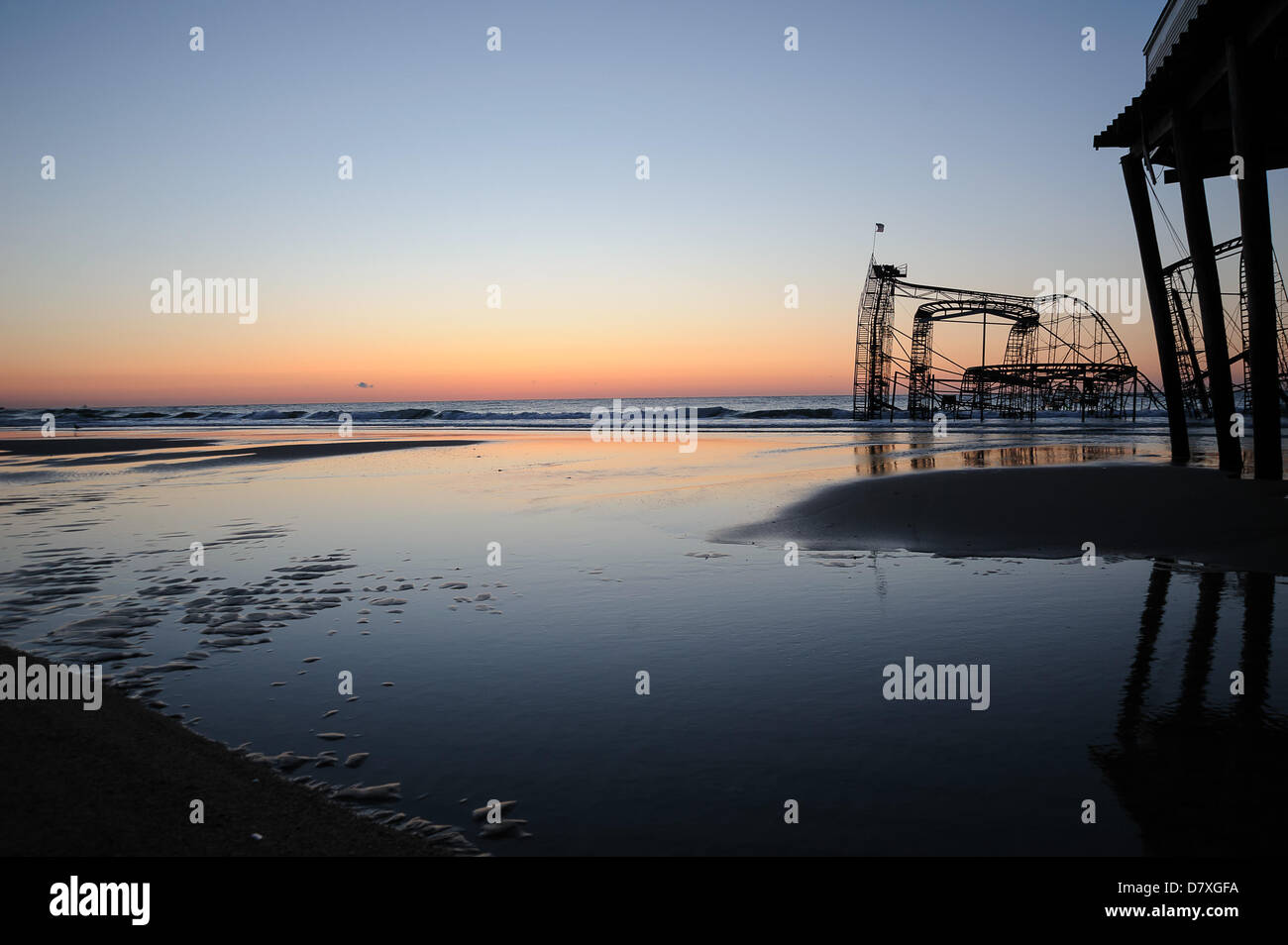 Seaside Heights,  NJ, USA, 14 May, 2013. The sun rises over the Jet Star roller coaster off of the Seaside Heights boardwalk.  The coaster became a widely-recognized symbol of the destruction caused by Superstorm Sandy. Stock Photo