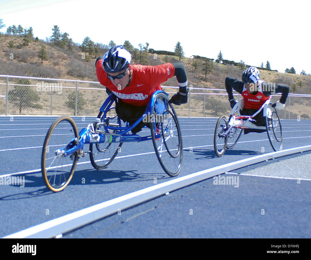 May 14, 2013: Marine Corps wounded warrior, Ivan Sears (l), leads Marine, Anthony McDaniel (r), through the first lap of the 1500 meters during Warrior Games track & field events at the United States Air Force Academy, Colorado Springs, Colorado. Over 260 injured and disabled service men and women have gathered in Colorado Springs to compete in seven sports, May 11-16. All branches of the military are represented, including Special Operations and members of the British Armed Forces. Stock Photo