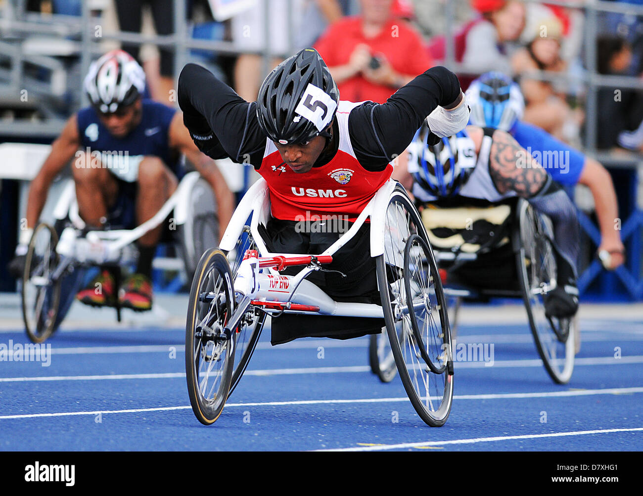 May 14, 2013: Marine Corps wounded warrior, Anthony MDaniel (5), in men's wheelchair action during Warrior Games track & field events at the United States Air Force Academy, Colorado Springs, Colorado. Over 260 injured and disabled service men and women have gathered in Colorado Springs to compete in seven sports, May 11-16. All branches of the military are represented, including Special Operations and members of the British Armed Forces. Stock Photo