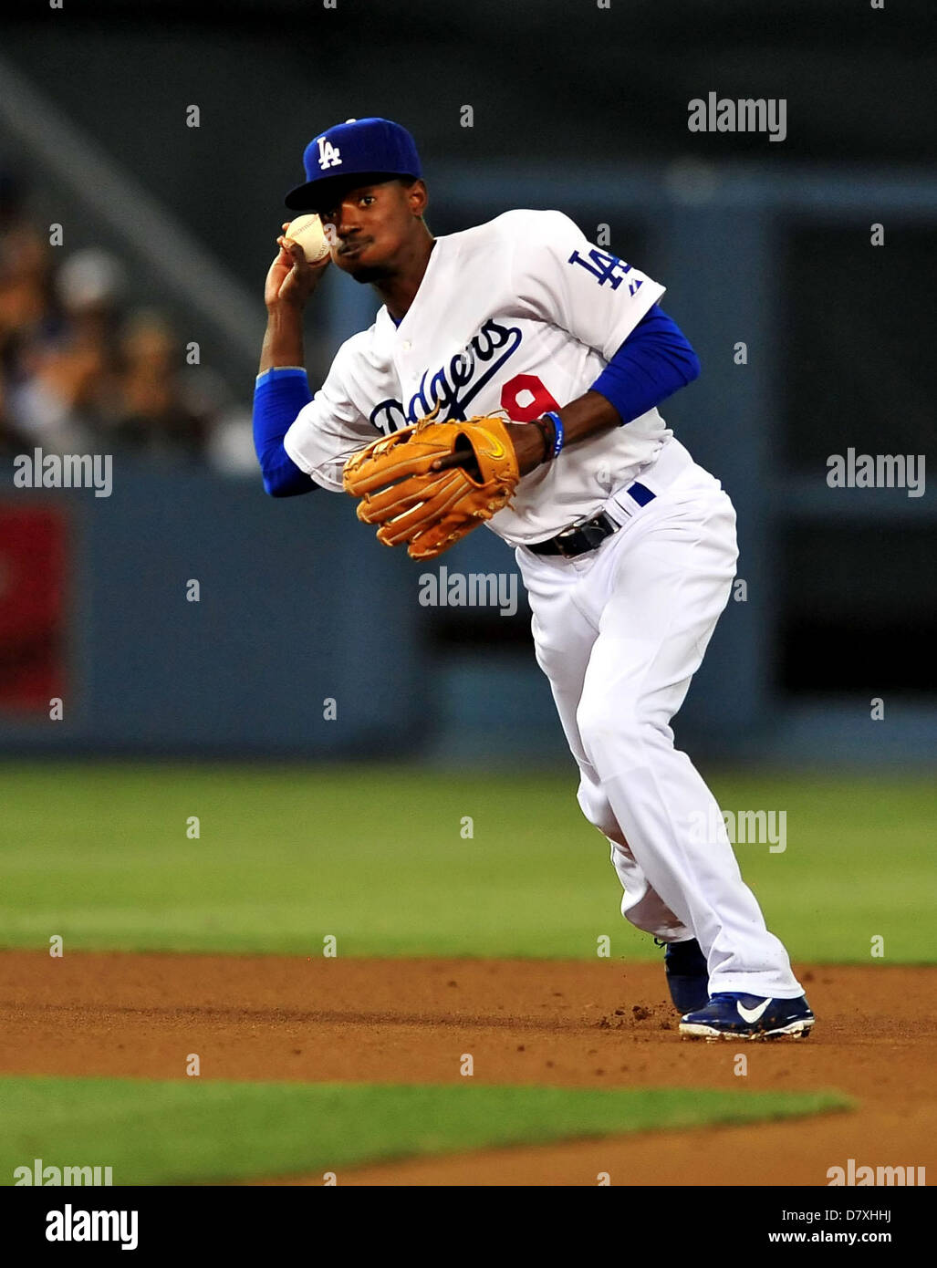 Los Angeles, CA. USA. May 14, 2013. Los Angeles Dodgers shortstop Dee Gordon  #9 throws to 1st base for the out in the 5th inning during the Major League  Baseball game between