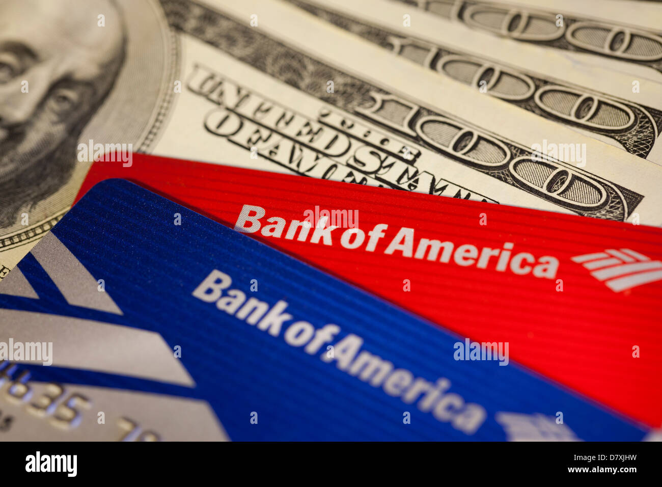 Bank of America credit cards on one hundred dollar bills Stock Photo