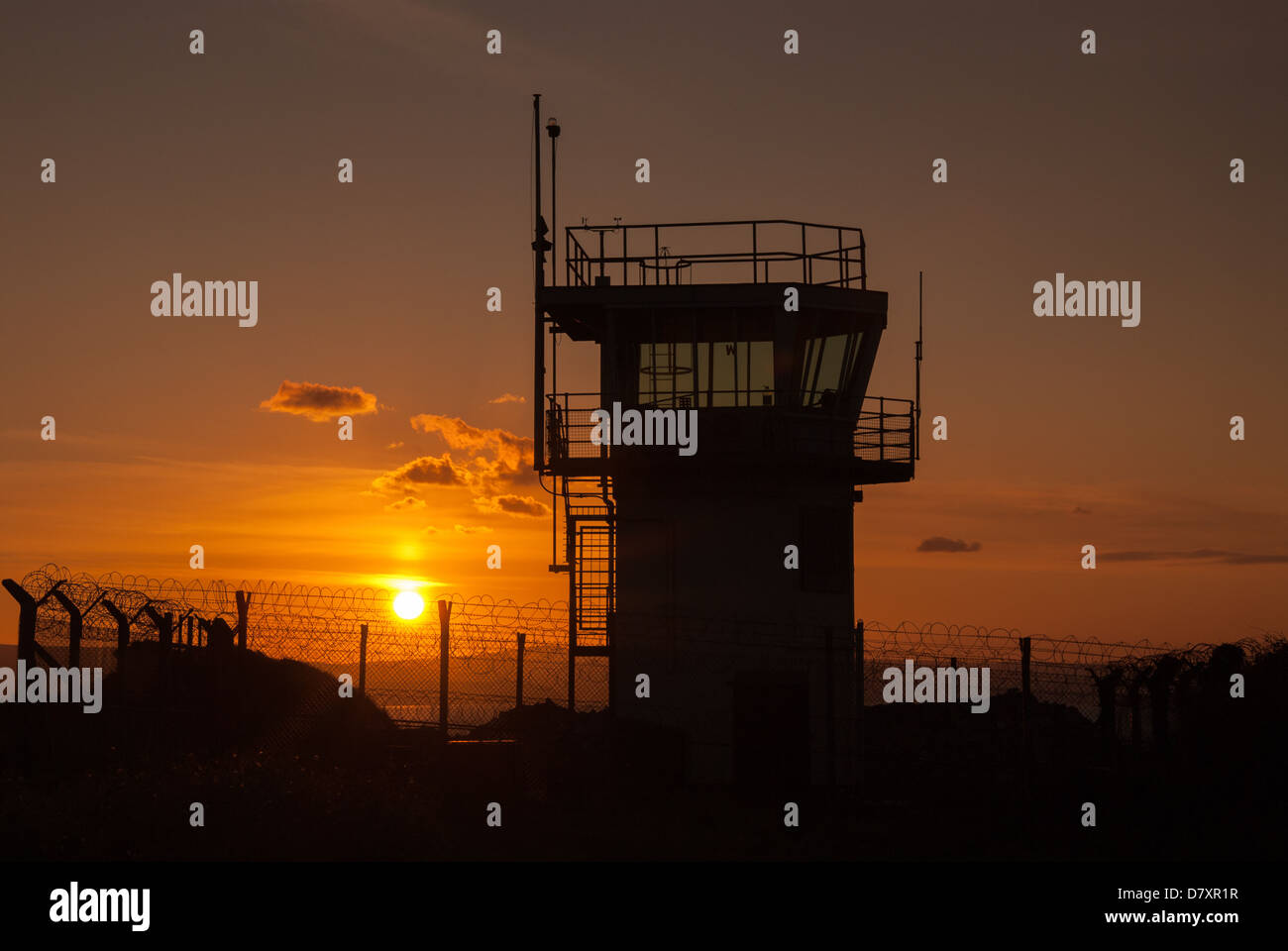 Sunset behind watchtower Stock Photo