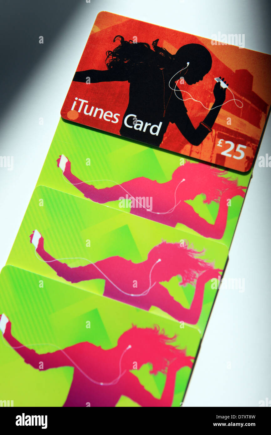 itunes gift voucher cards in a shaft of light Stock Photo