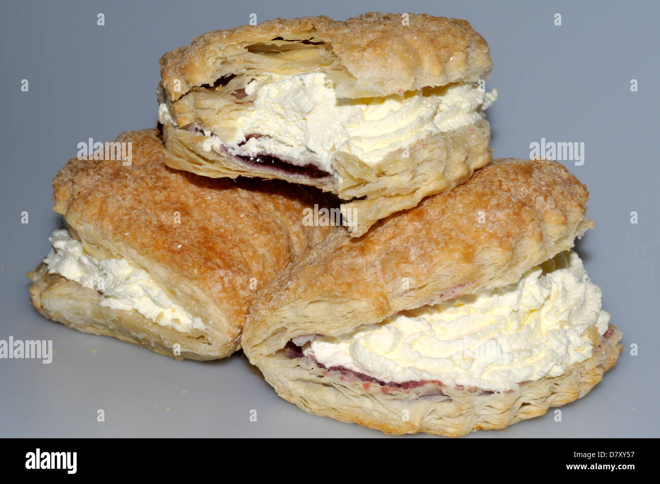 raspberry-cream-turnovers-showing-the-cream-jam-and-flaky-pastry-D7XY57.jpg