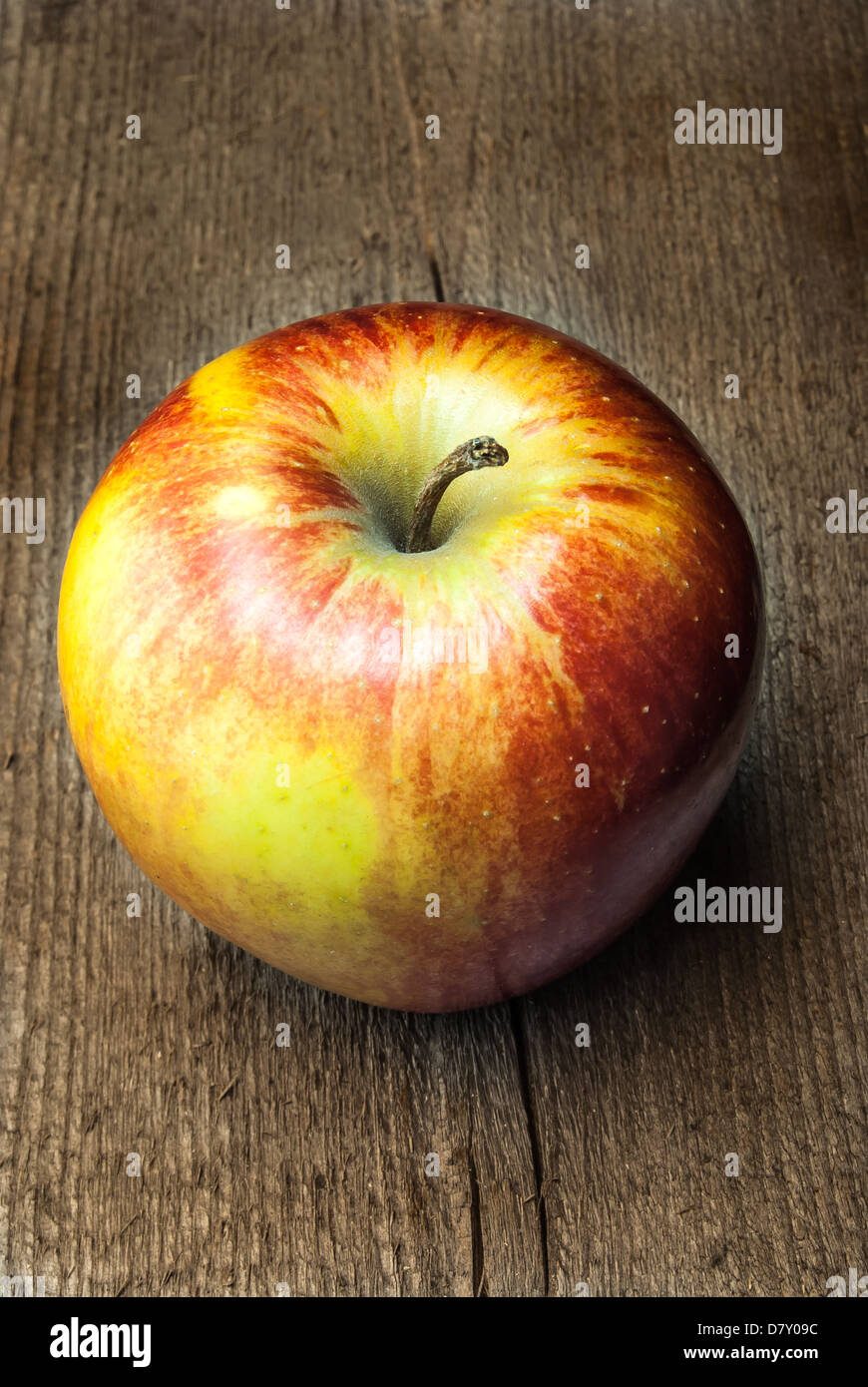 Apple on an old wood Stock Photo