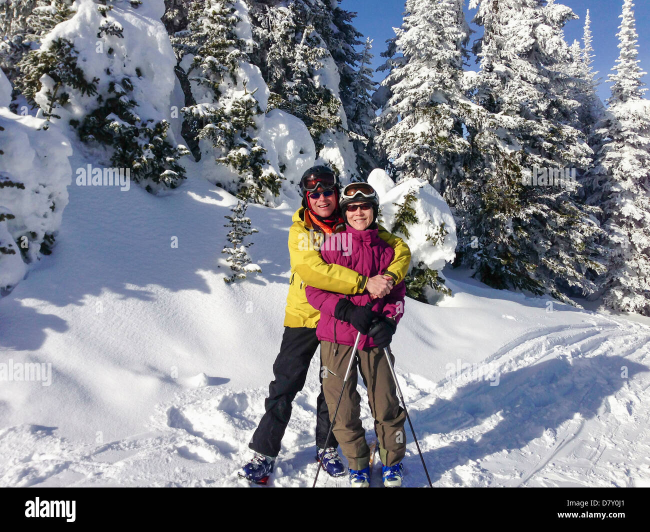 Father and daughter wearing ski gear outdoors Stock Photo Alamy