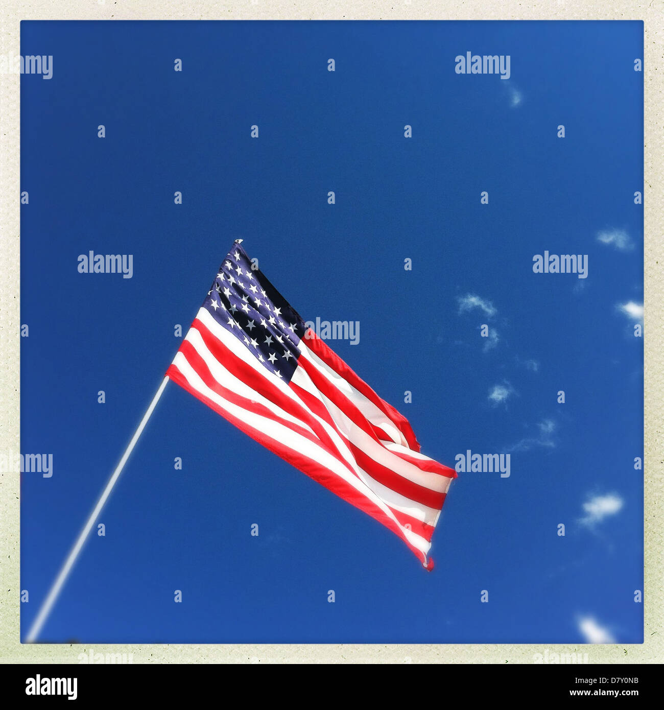 American flag against blue sky - Smartphone Captured Stock Image