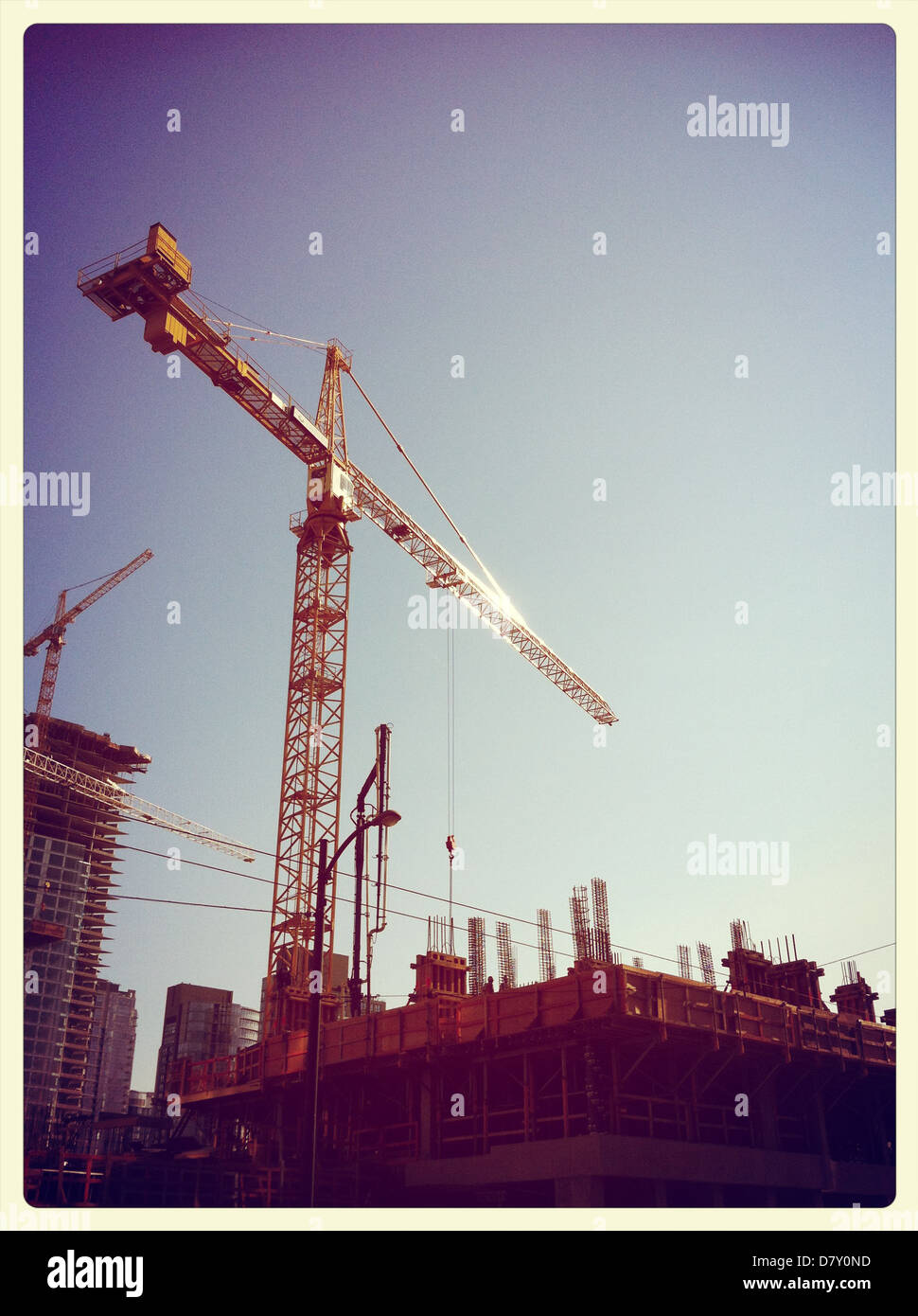 Crane overlooking cityscape - Smartphone Captured Stock Image