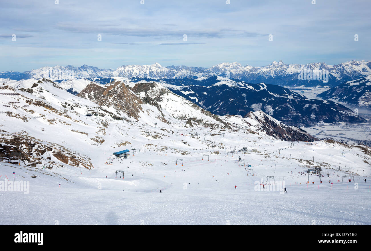 Winter with ski slopes of kaprun resort next to kitzsteinhorn peak in austrian alps Stock Photo
