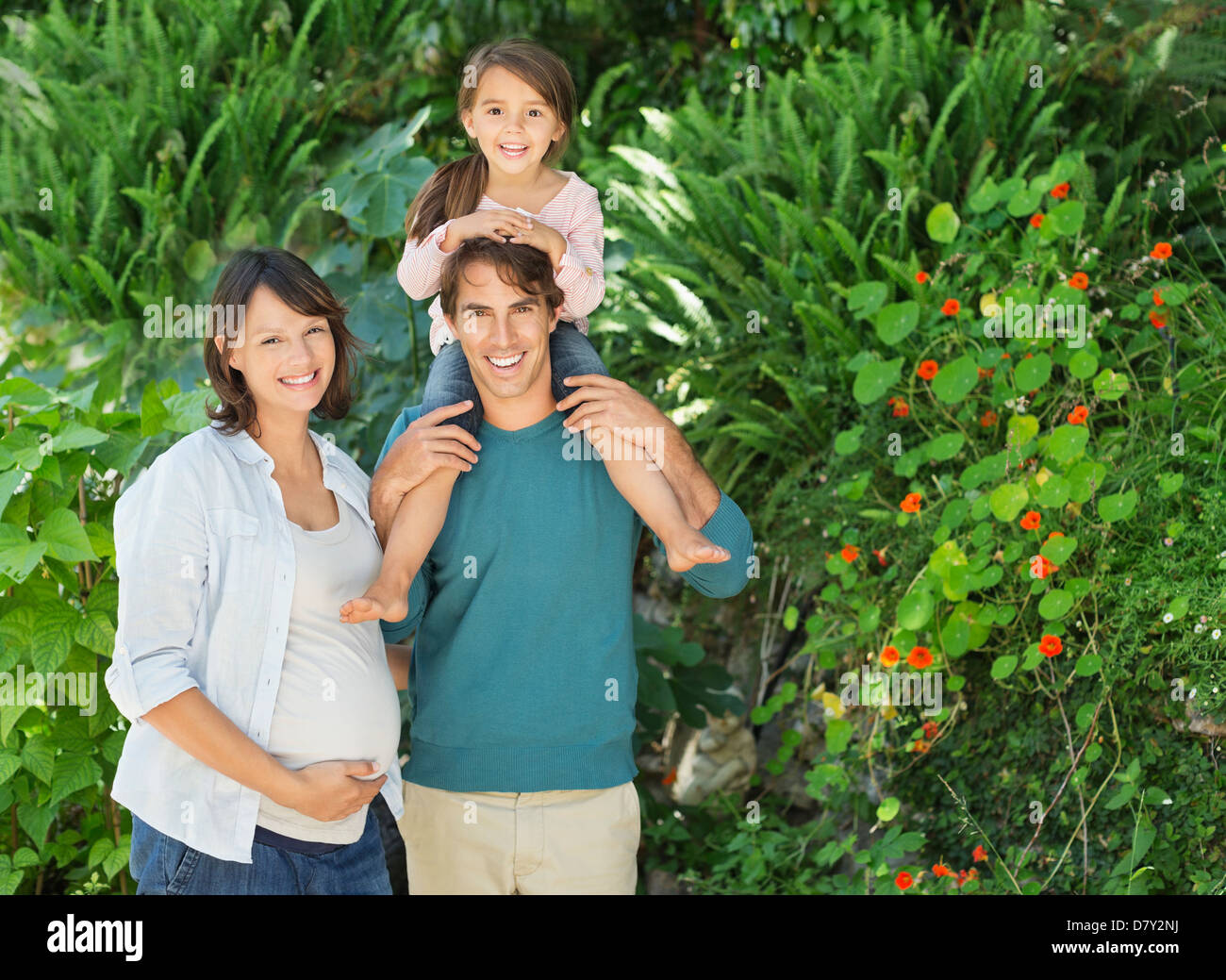 Family smiling together outdoors Stock Photo