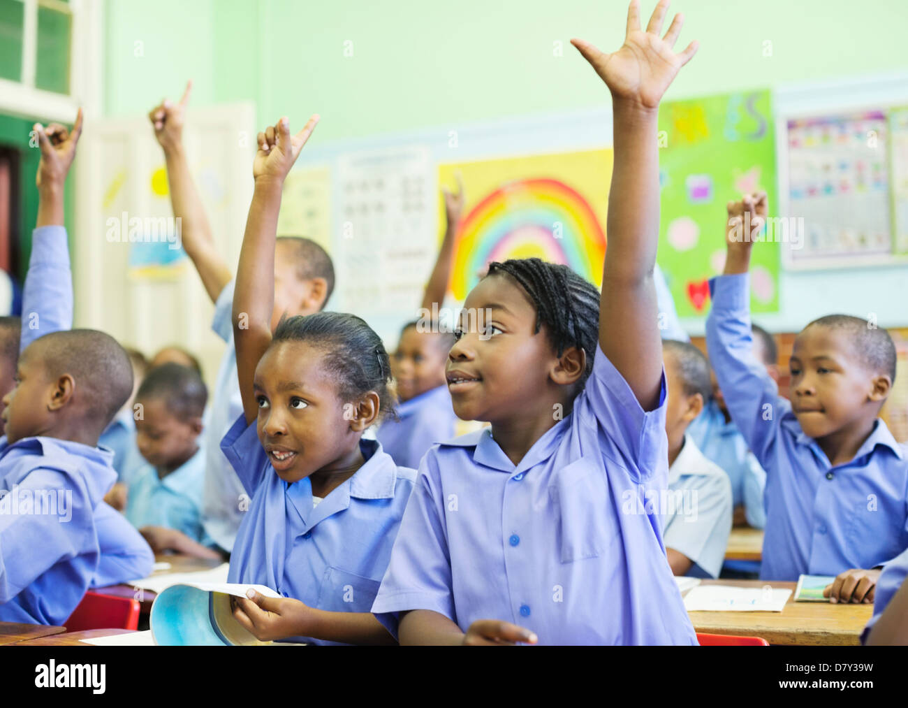 students raising hands