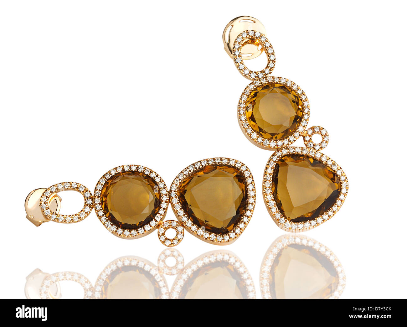 Luxury topaz earring surrounded by shiny diamond Stock Photo