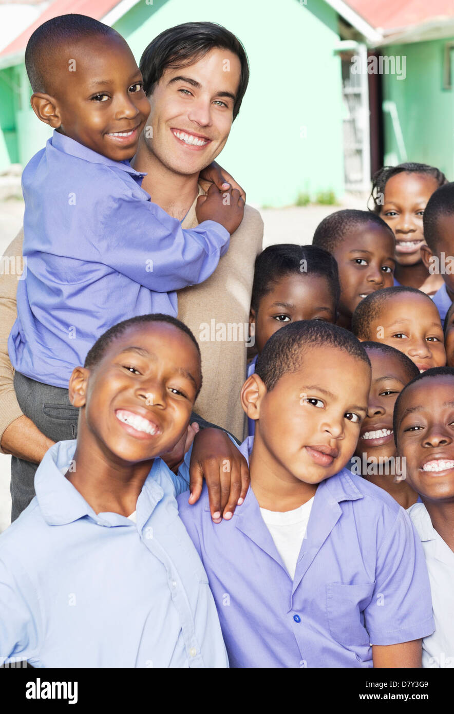 Students and teacher smiling outdoors Stock Photo - Alamy