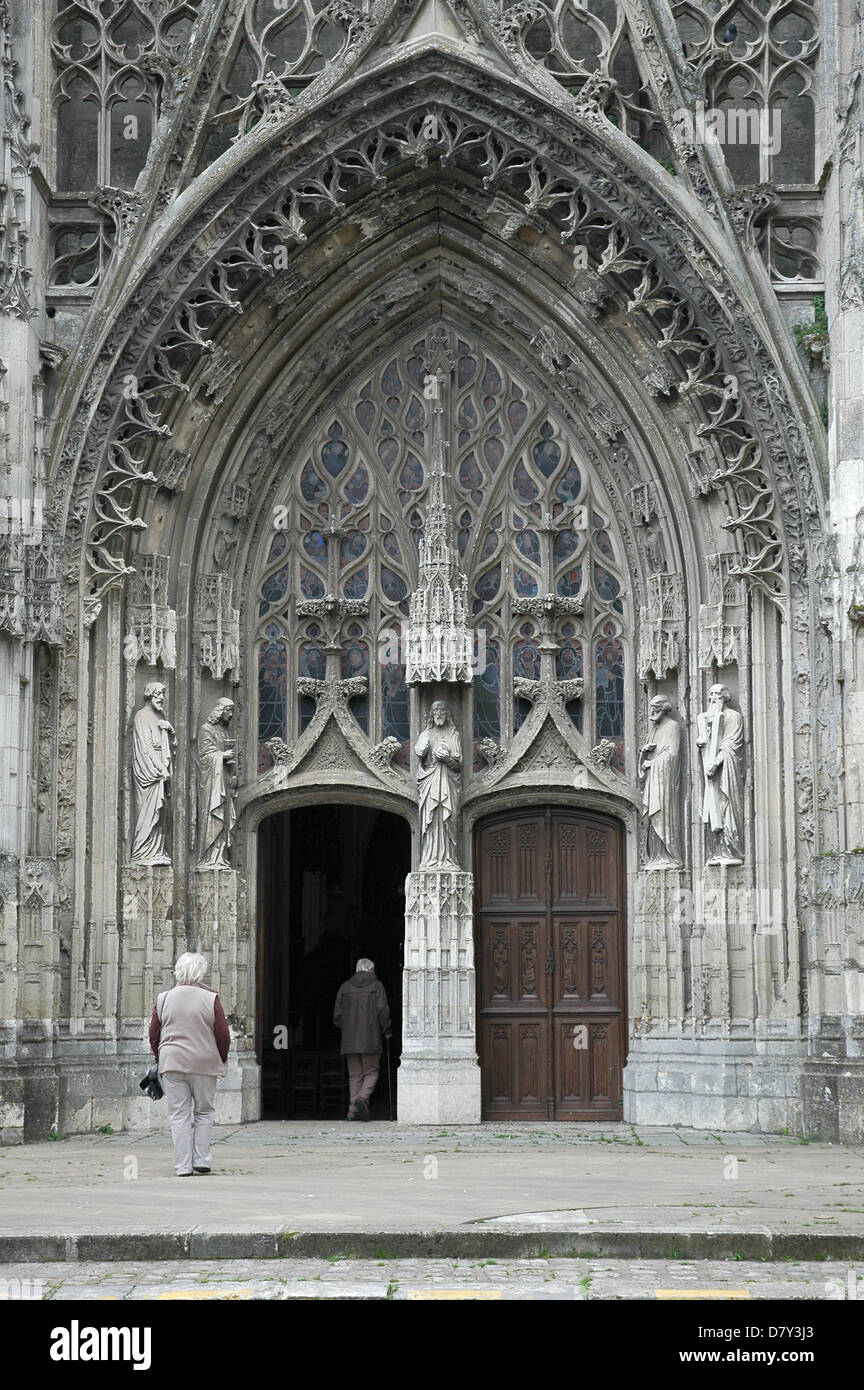 Two sighteers entering the door of the Abbey Church of the Trinity, Vendome, France. Stock Photo