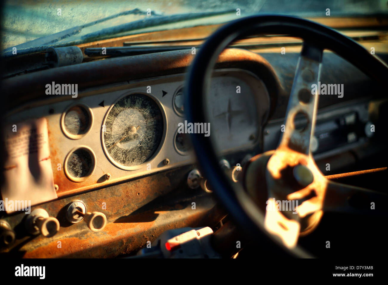 close up of a steering wheel and a dashboard of a old American car Stock Photo