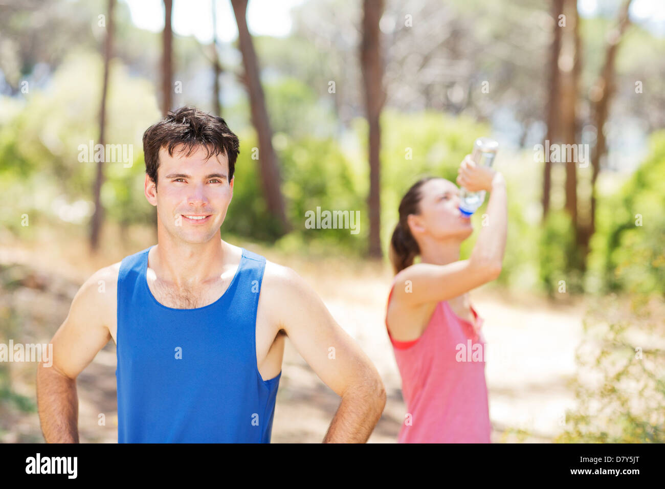 Couple resting during workout outdoors Stock Photo