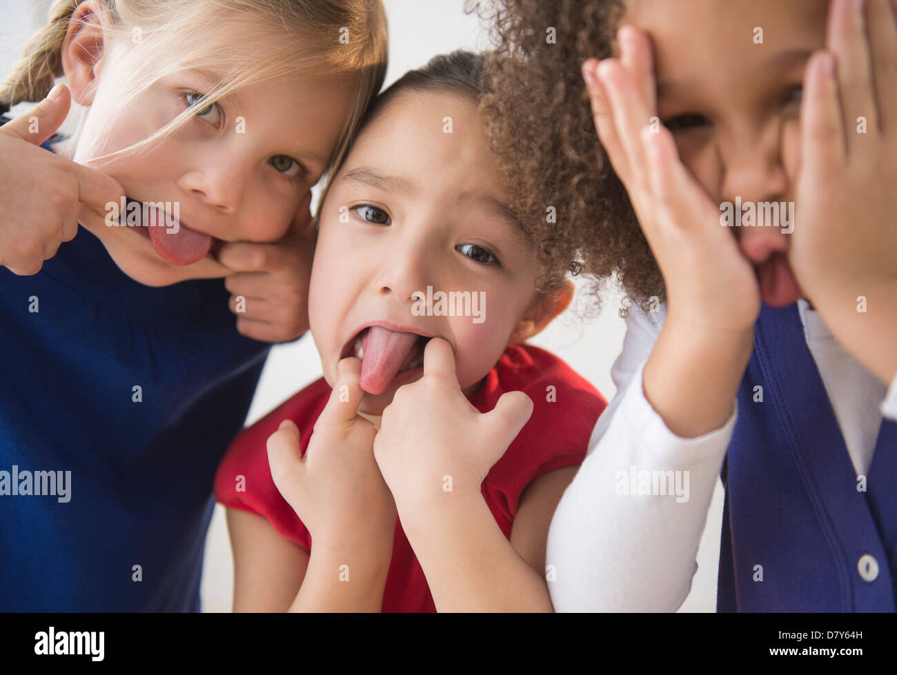 Girls making faces together Stock Photo