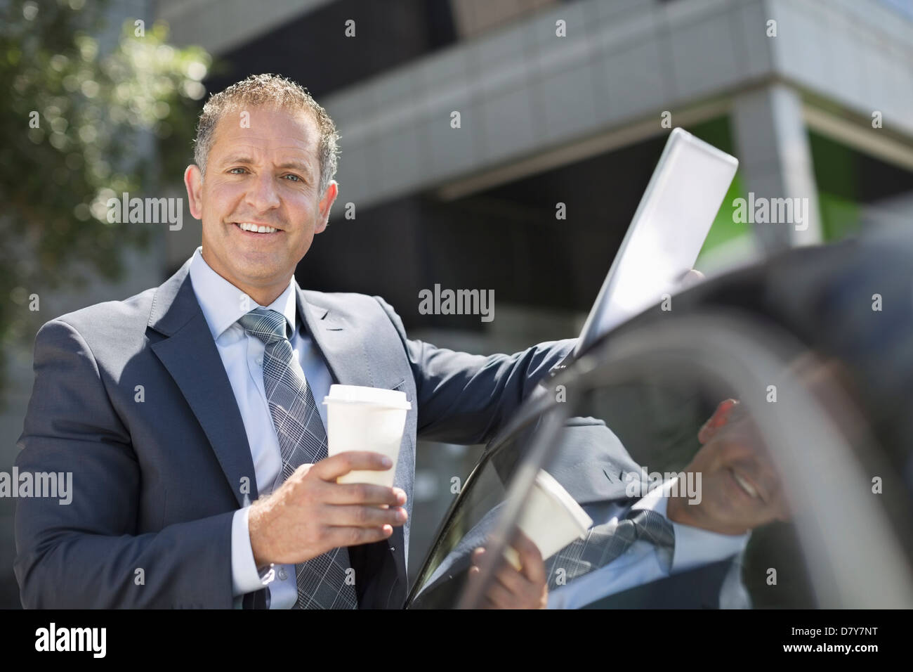 Businessman using tablet computer outdoors Stock Photo