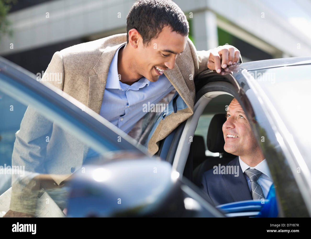 Businessmen talking in car Stock Photo
