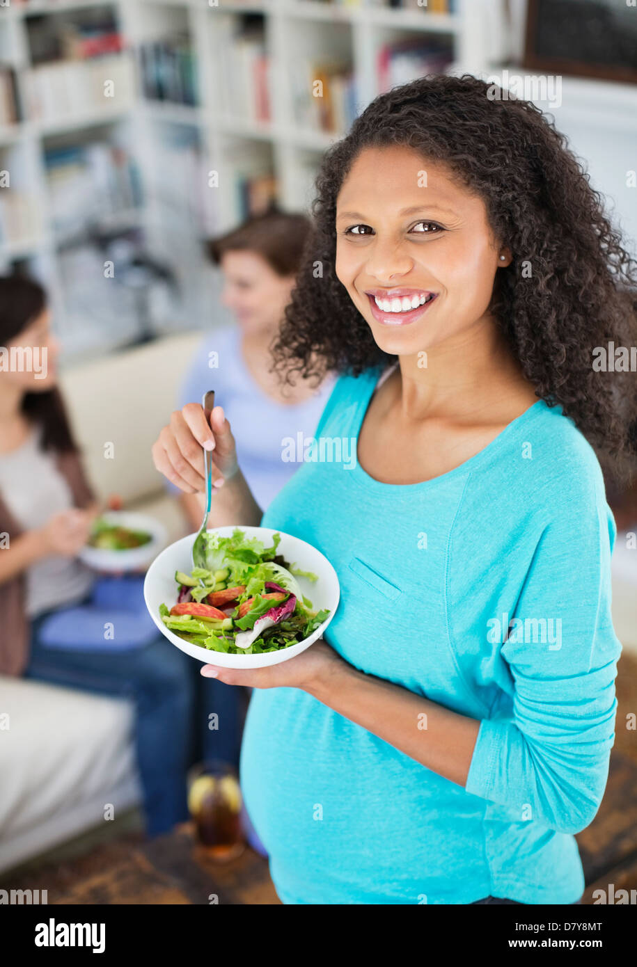 Pregnant woman eating salad Stock Photo Alamy