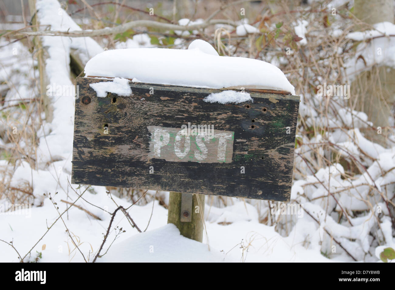 Snow village uk post box hi-res stock photography and images - Alamy