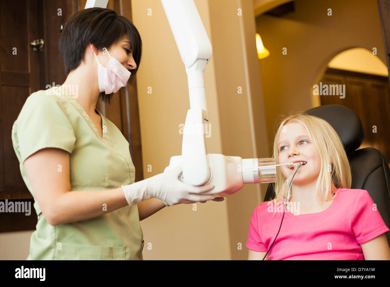 Technician making xray of girl's teeth Stock Photo Alamy