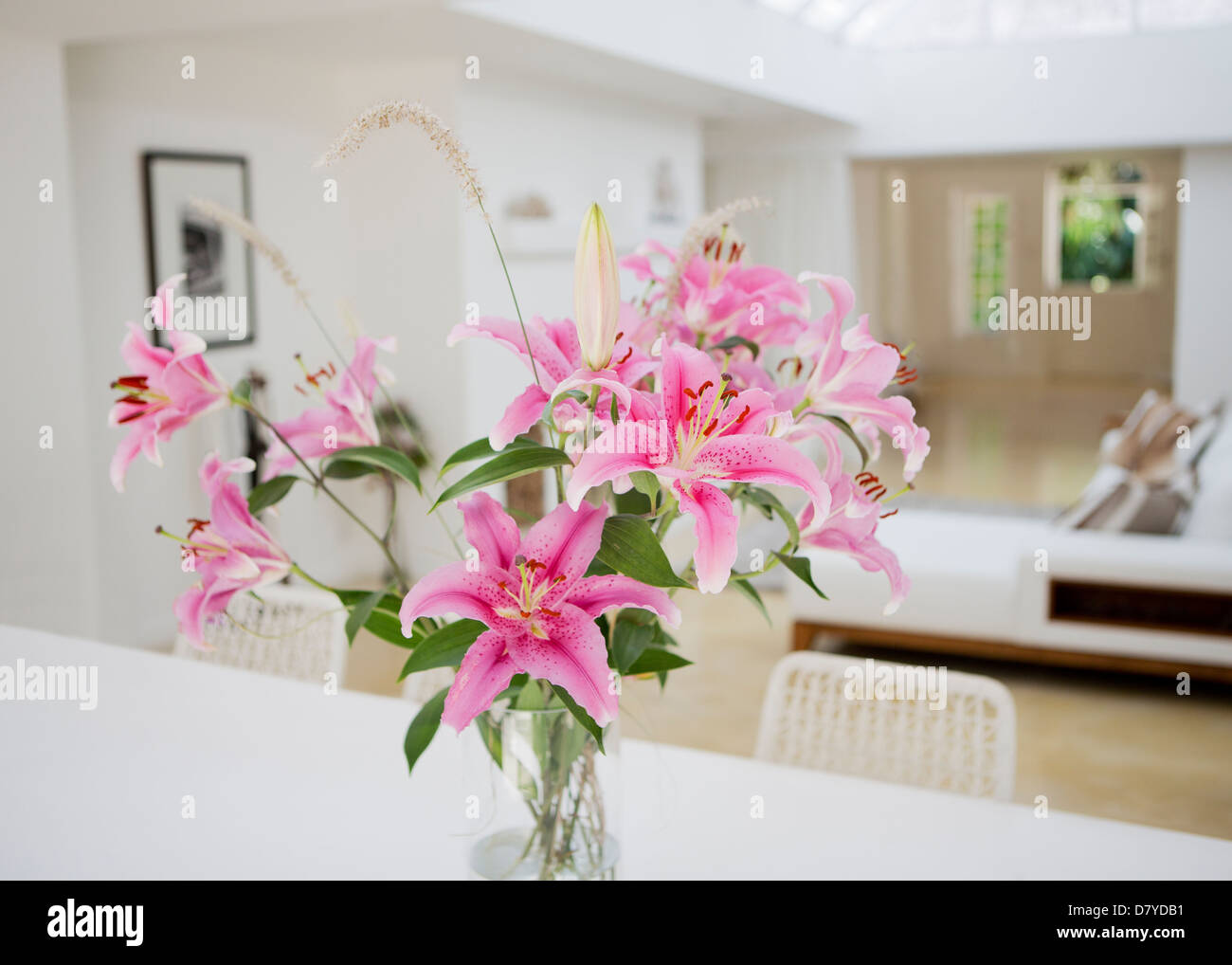 Bouquet of flowers on dining table Stock Photo
