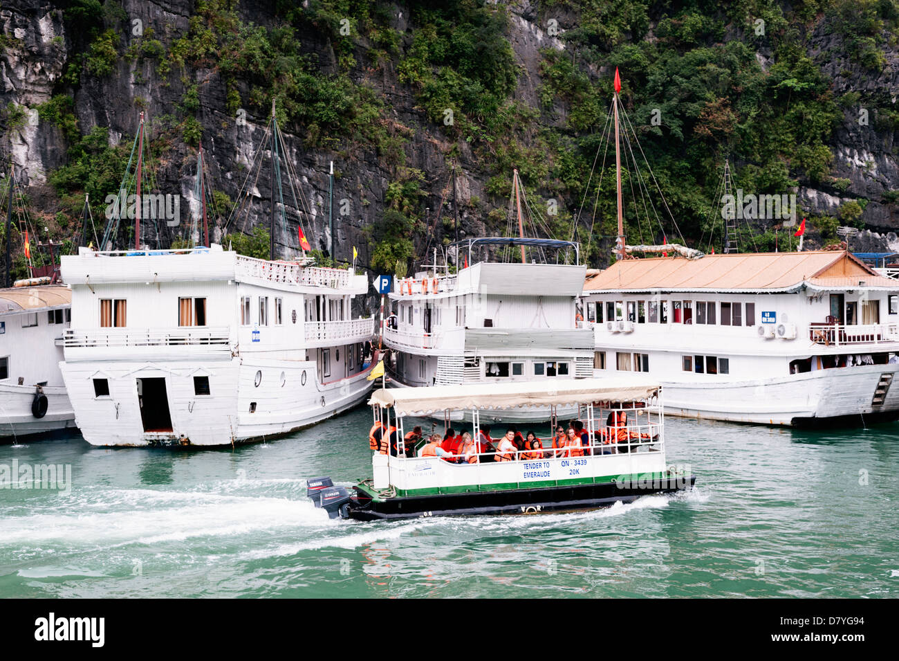 Ha Long Bay, Vietnam - tourist cruise boats and tender Stock Photo