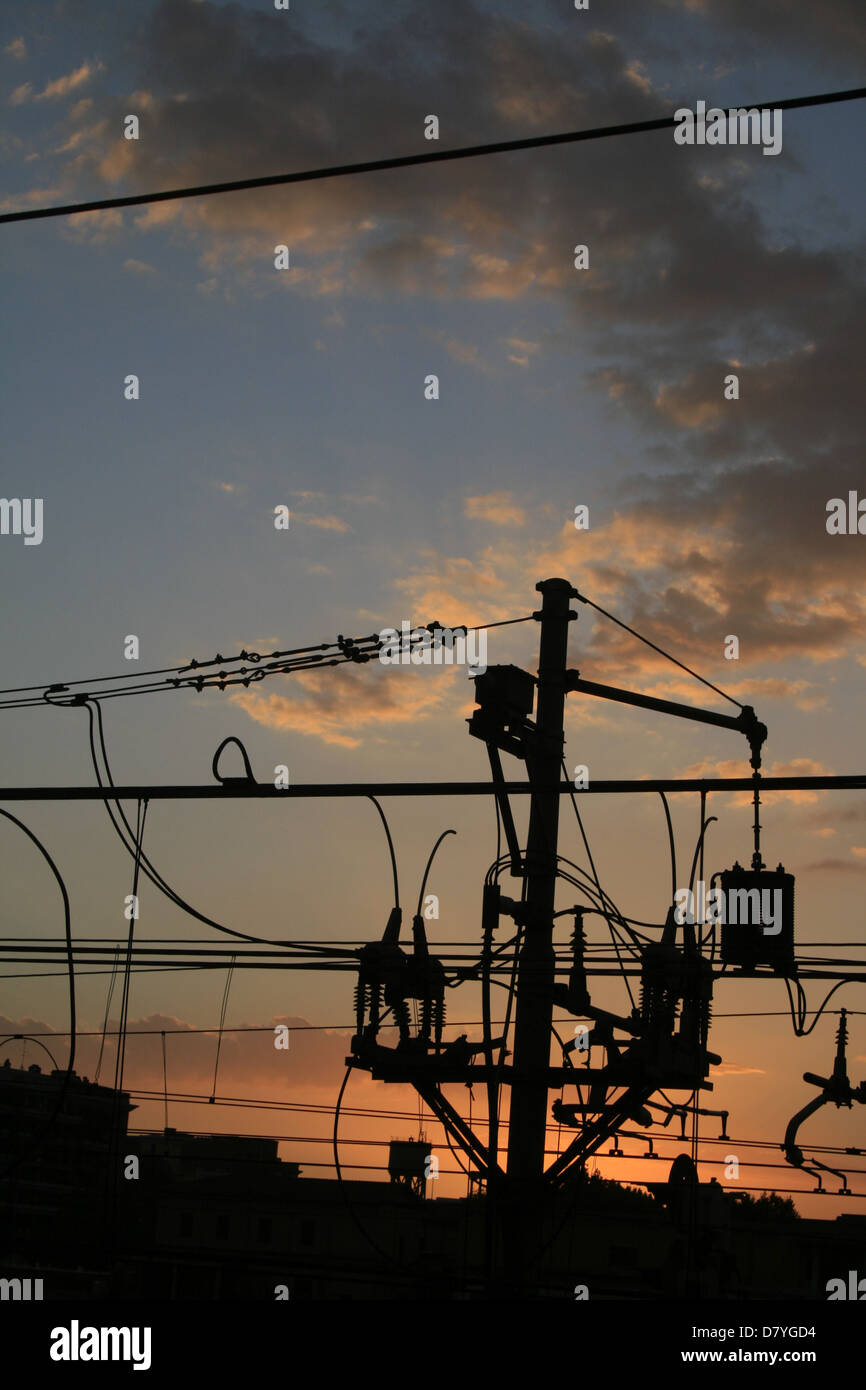overhead train power lines in rome italy at sunset Stock Photo Alamy