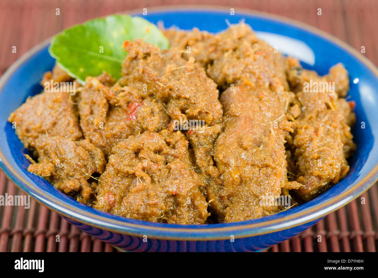 Rendang Daging - Dry beef curry with coconut milk and spices. Traditional Indonesia, Malaysian and Singaporean dish. Stock Photo