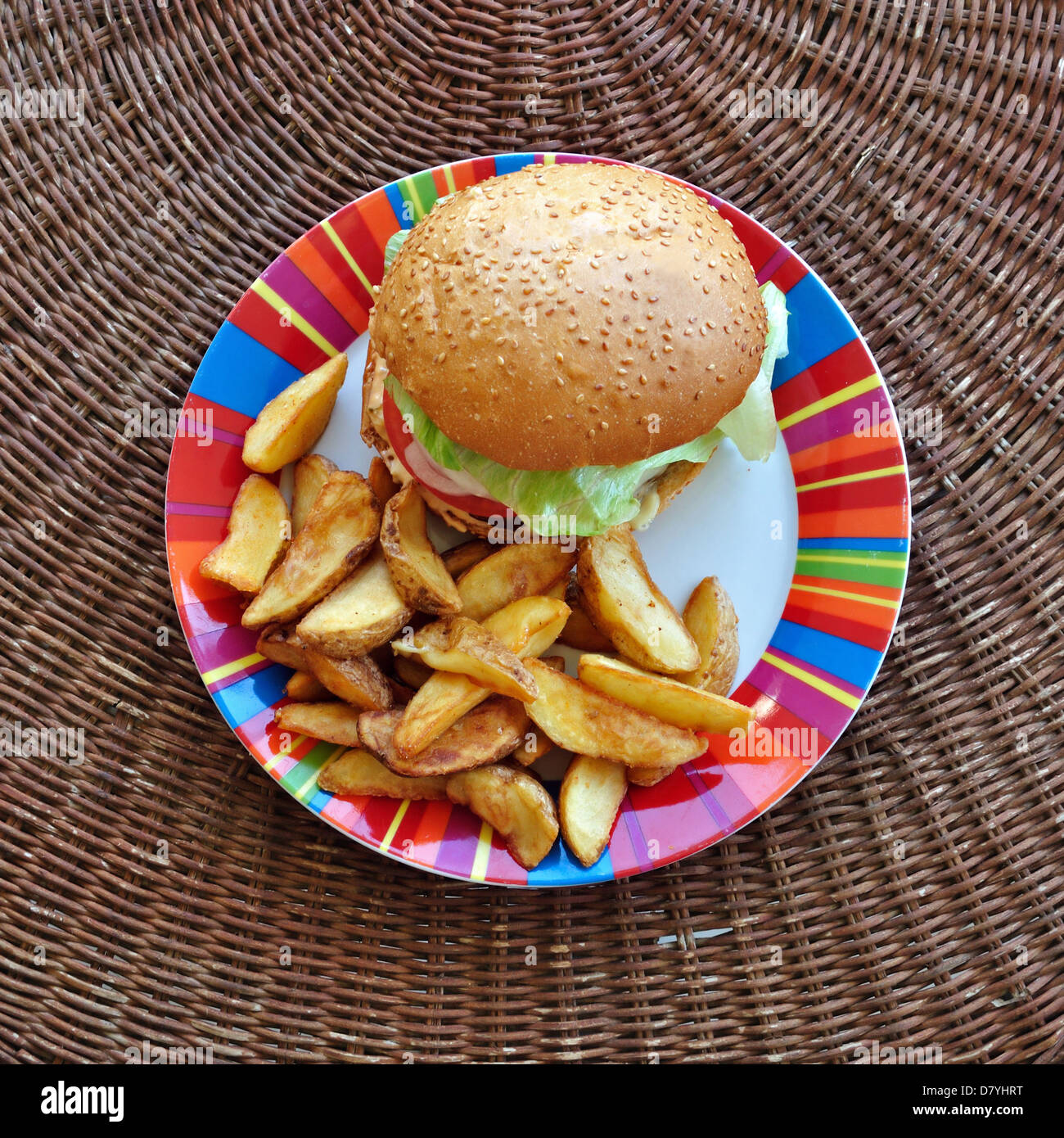 Cheeseburger and fries dish. Fast food background. Stock Photo