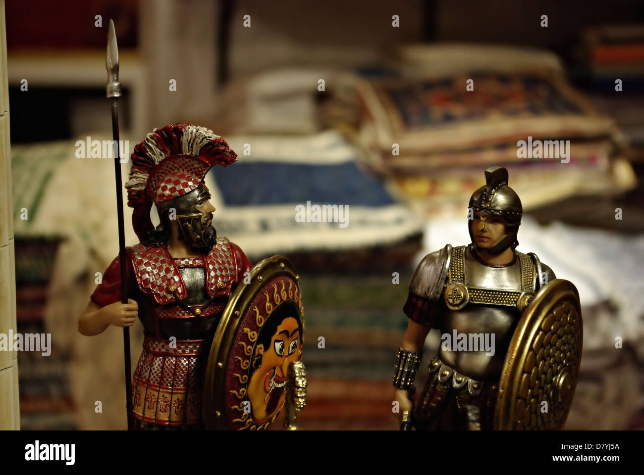 Shelf in antiquities shop with metal medieval crusades knight soldiers. Stock Photo