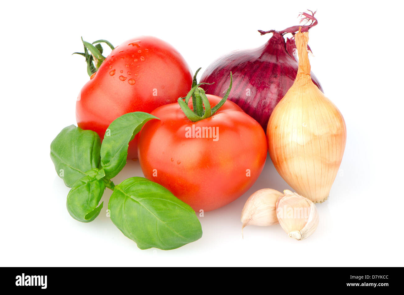 Composition of: tomato, tagliatelli, garlic and basil Isolated on white background. Stock Photo