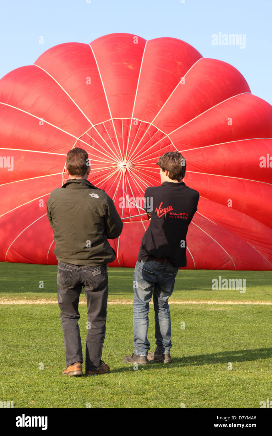 Hot air balloon being inflated in preparation for flight England UK Stock Photo