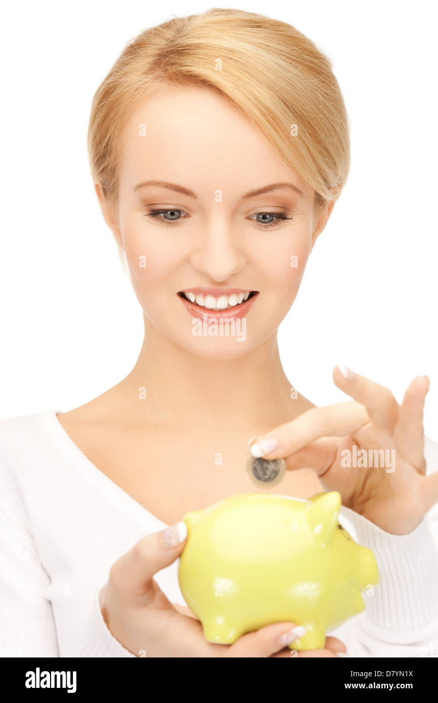 woman with small piggy bank and coin Stock Photo - Alamy