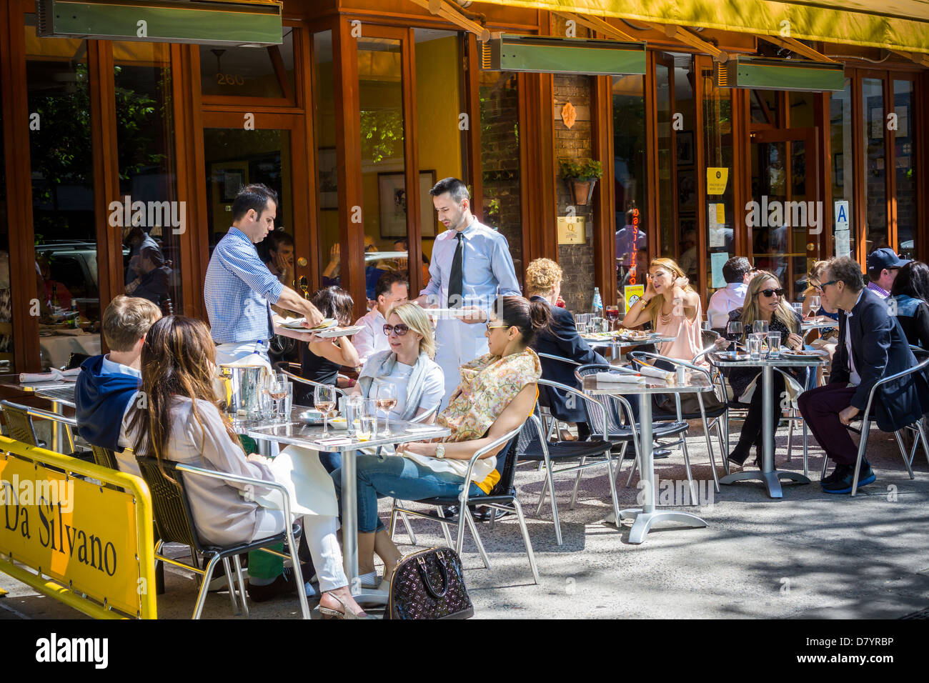 Busy al fresco dining at Da Silvano sidewalk cafe on Sixth Avenue in