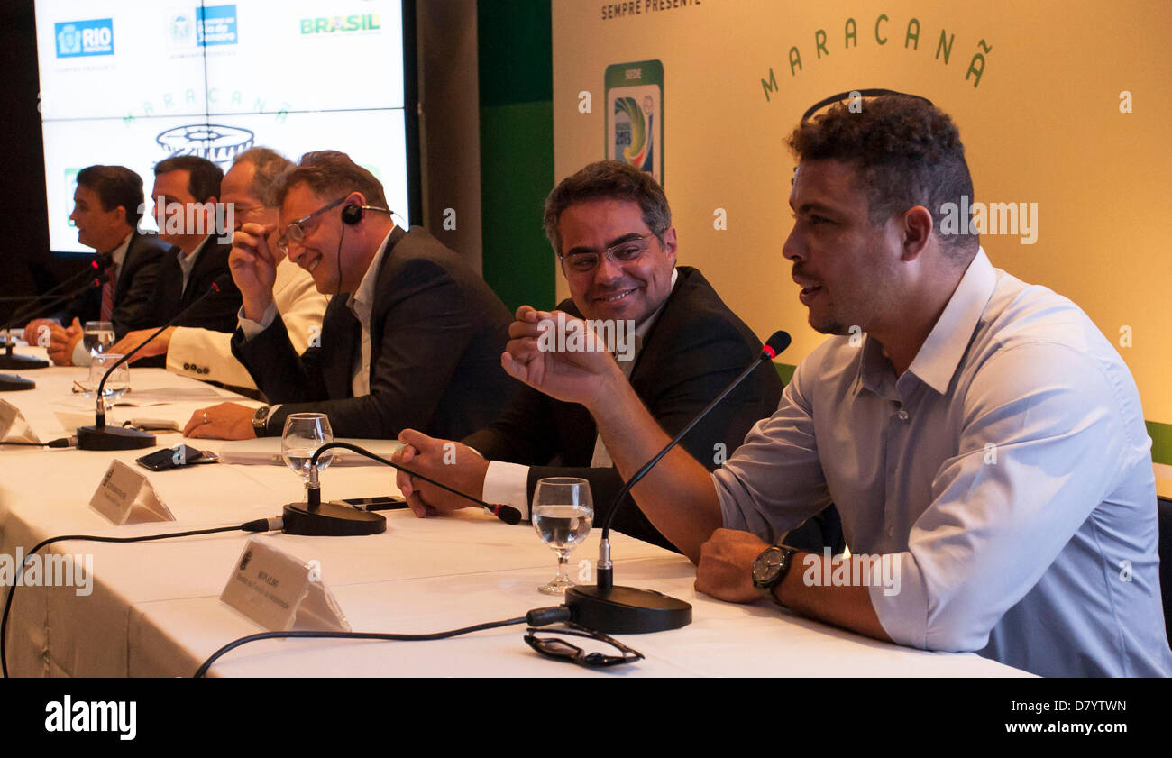 Ronaldo(foreground) cracks a joke during a FIFA press conference with FIFA´s General Secretary Jerome Valcke(third person along), while discussing progress on the Maracana Football Stadium, and the completion of construction work in time for the Confederations Cup Football tournament, where England play Brazil on the 2nd of June,2013, and the World Cup in 2014. Maracana Stadium, Rio de Janeiro, Brazil 15/05/2013 Stock Photo