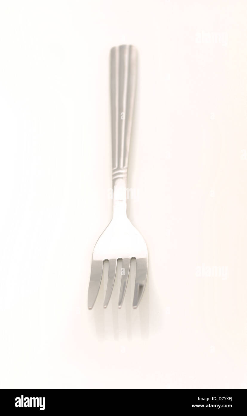 single fork utensil on white background Stock Photo Alamy